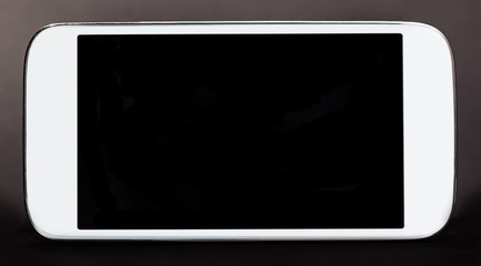 white smartphone, mobile, on a dark background