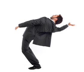Young businessman simulates the position of Neo in the Matrix mo