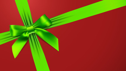 Green bow on red background