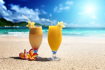 fresh fruit juices on a tropical beach