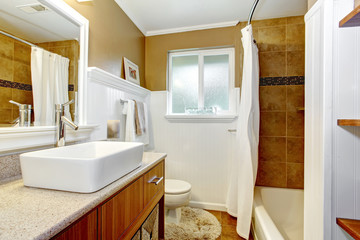 Brown and white cozy bathroom wtih window