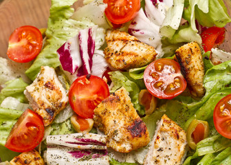 Cesar salad with roasted chicken meat 