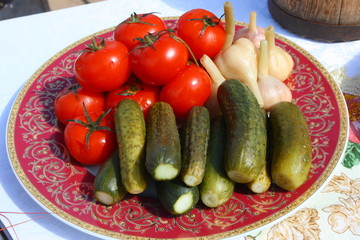 Traditional Russian tomatoes, pickled cucumbers and garlic 