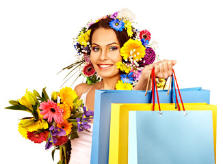 Woman with shopping bag holding flower. Isolated.
