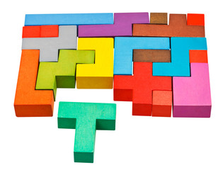 multicoloured puzzle blocks and T-shaped piece