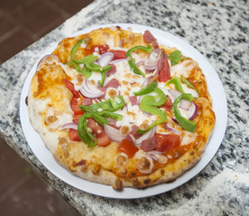 Vegetarian pizza at a hotel snack bar