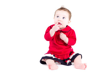 Little baby girl in a red dress