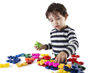 boy with puzzle toys