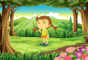 Obraz na płótnie Canvas A cute little girl at the forest
