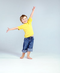 Joyful little boy playing a plane © konradbak