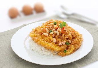 fried omelet topped on rice