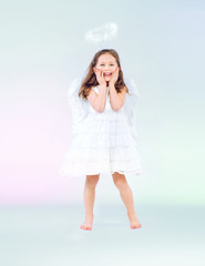 Cute little girl as an angel