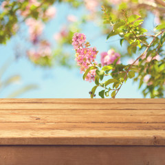 Spring background with empty wooden deck table