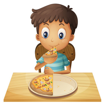 A young boy eating pizza