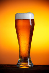 Beer glass on wooden table still life