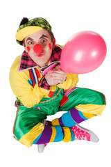 clown with a balloon in a hand isolated on a white