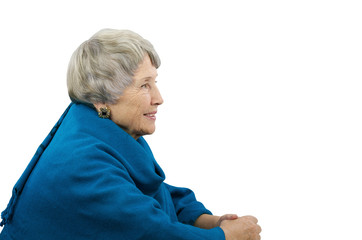 Old gray-haired woman in blue poncho
