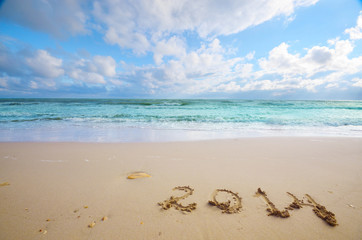 Year 2014 coming concept on beach