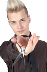 Portrait of handsome man with pair of scissors