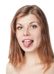 Beautiful young woman showing tongue