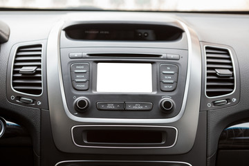 Fototapeta na wymiar Panel of a modern car with a white screen multimedia system