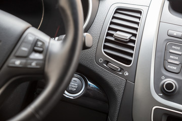 Interior of vehicle with automatic start engine button