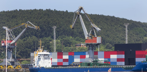 boats loading goods at the port