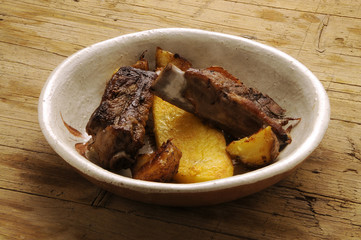 Coste di maiale with polenta y patate