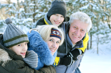 Happy family in winter outdoors