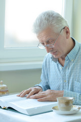 Elderly man is resting at home