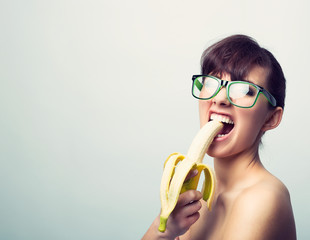 woman with nerd glasses and banana