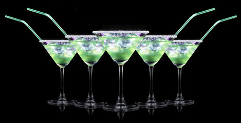 Cocktail Smoothie, with slices of kiwi on a black