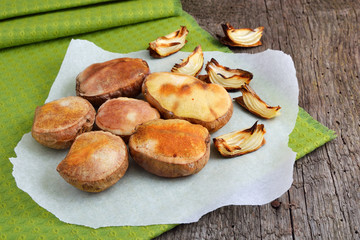 Baked halves of potatoes.