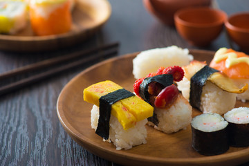 Salmon and caviar rolls served on a plate
