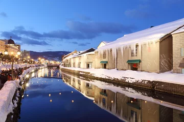 Fotobehang background of otaru canal in japan the winter evenning © charnsitr