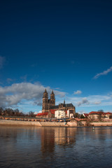 Magnificent Cathedral of Magdeburg at river Elbe with blue sky,