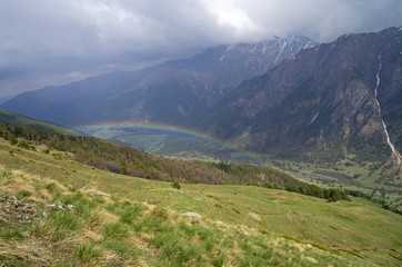 Fototapeta na wymiar Rainbow in a mountain gorge.