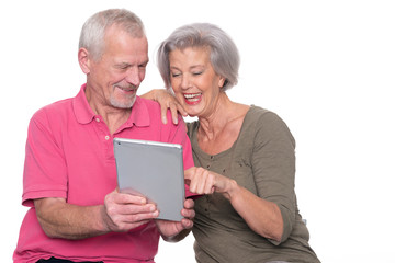 Senior couple with tablet