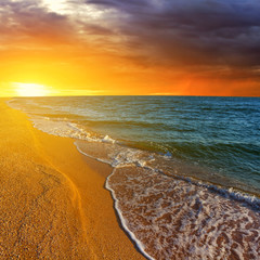 Panele Szklane  plaża morska o zachodzie słońca
