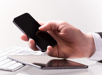 Hnad with mobile phone