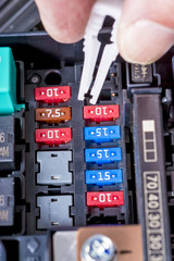 Fuse puller used to get a fuew from a cars engine