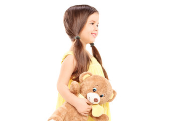 Cute child holding a teddy bear