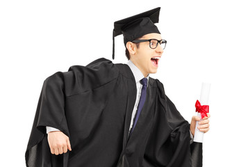 Graduate student running and holding a diploma