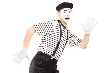 Fototapeta na wymiar Scared male mime artist running away