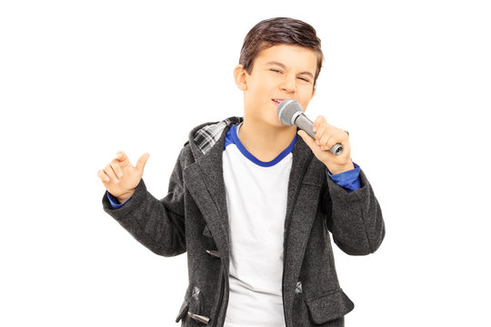 Boy singing on microphone