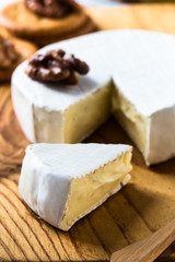 Camembert  cheese slice dipped with walnuts