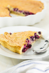 Piece of vanilla creamy cake in white dish