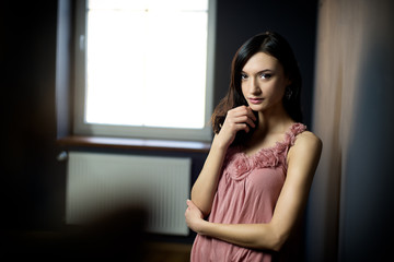 Beautiful gorgeous woman posing in green room