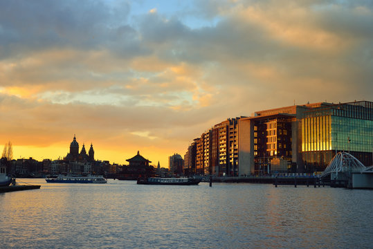 Amsterdam waterfront and skyline at sunset