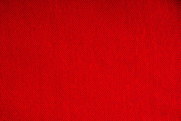 Closeup of red fabric textile material as texture or background